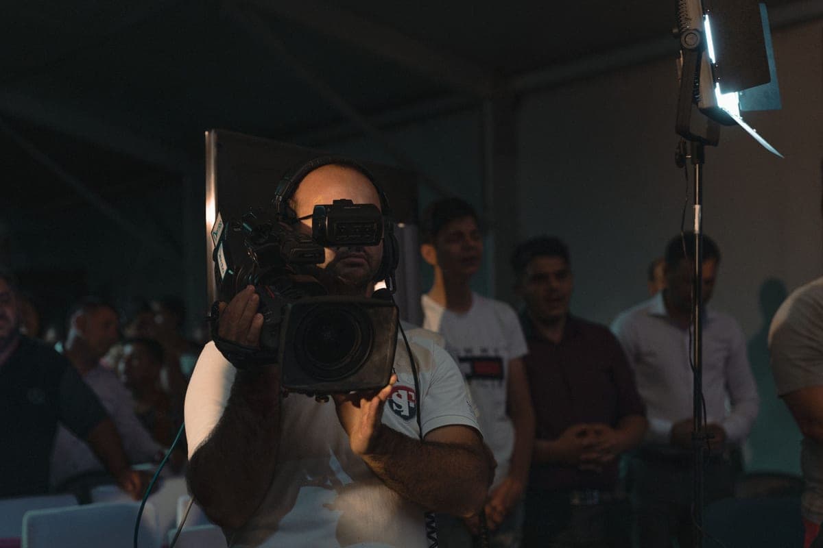 Camera operator filming a service inside a church